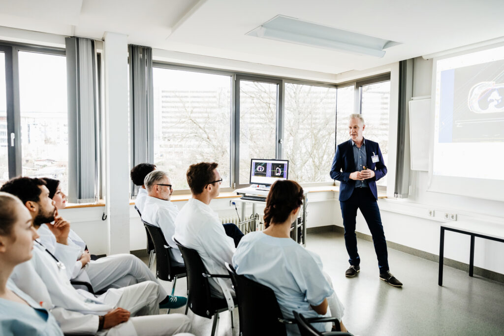 A group of medical students focussing during a teaching seminar at the hospital.