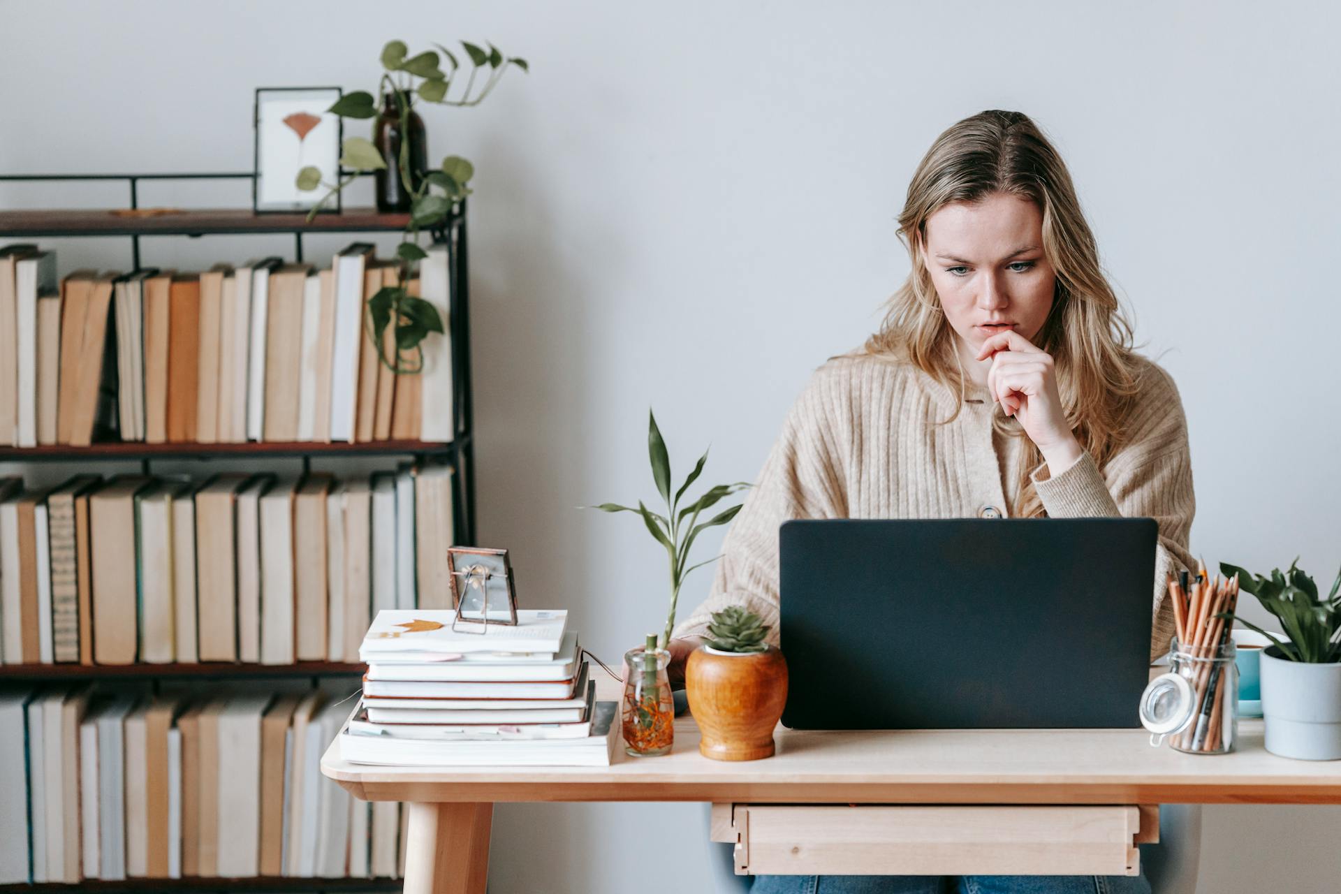 woman at computer studying digital experience analytics
