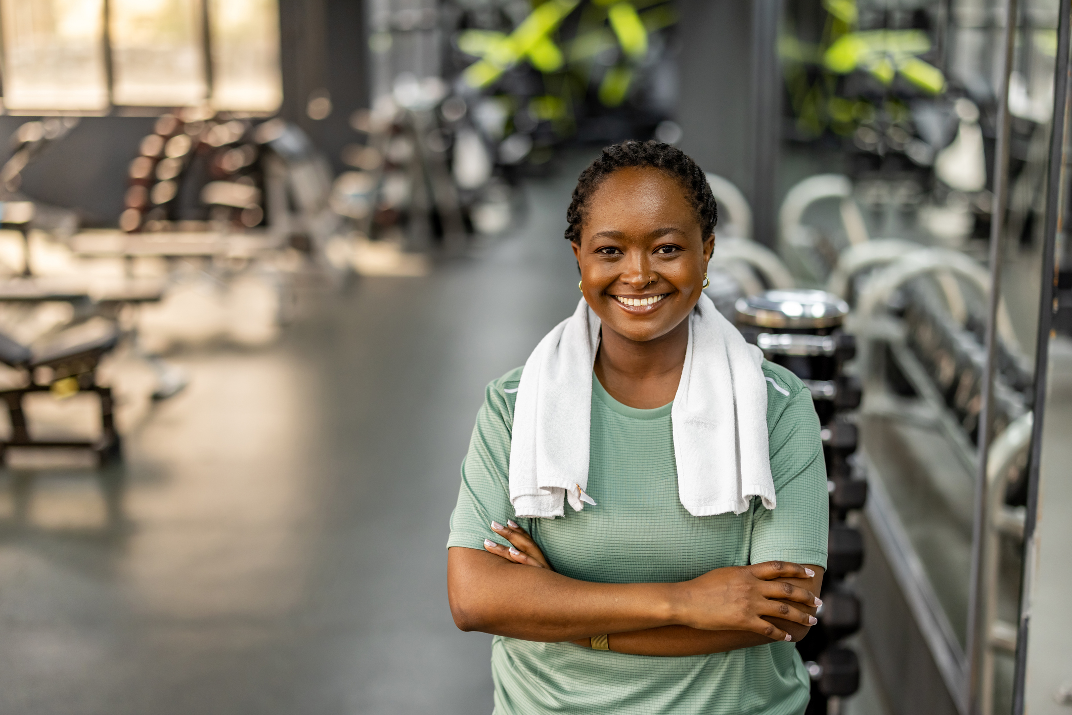 motivated gym member smiles in fitness center