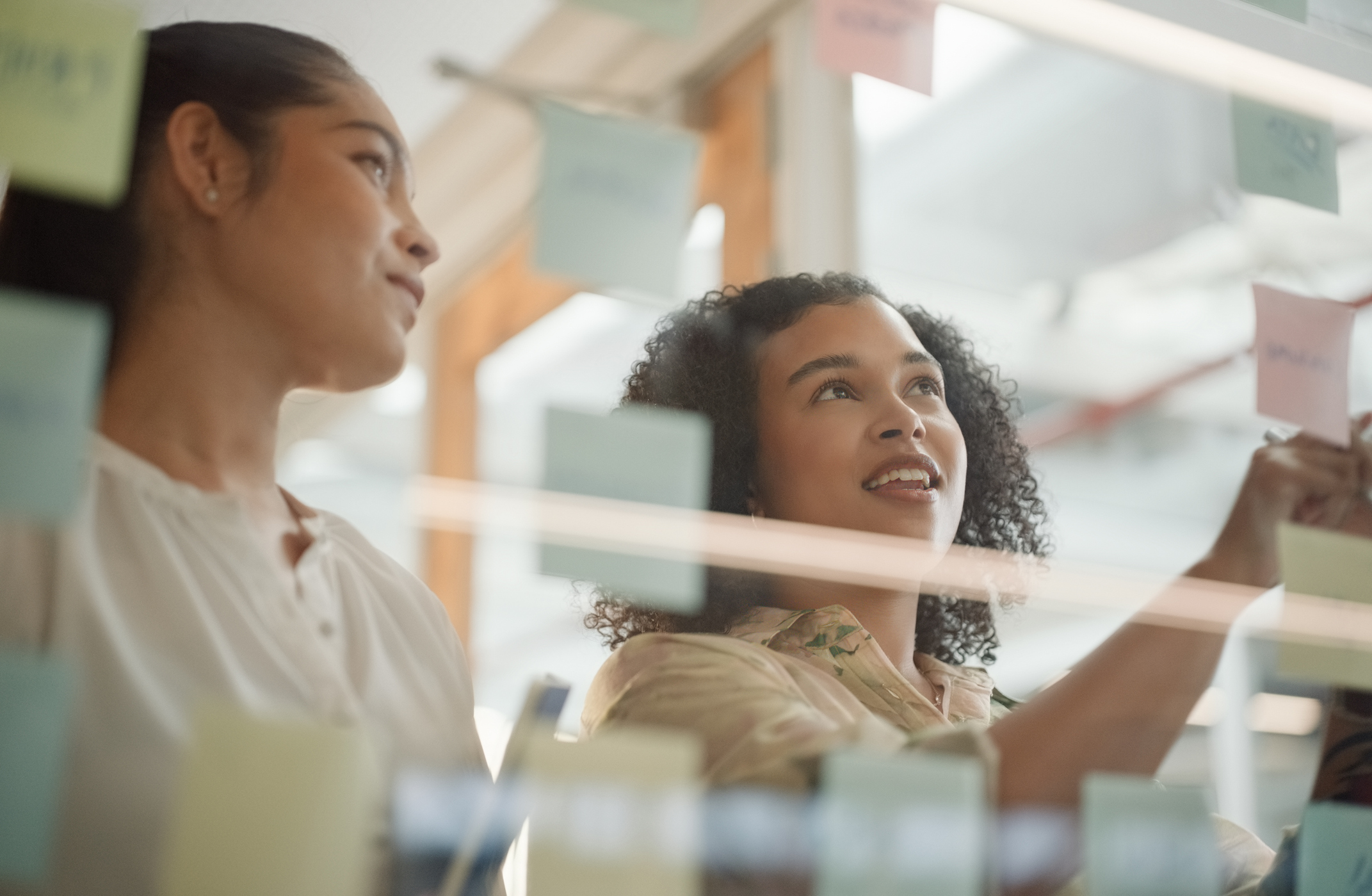 colleagues at work conduct customer lifecycle management through journey mapping