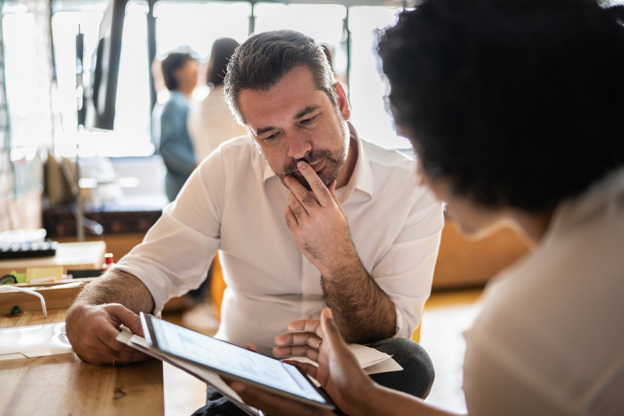 colleagues review data to avoid survey bias in analysis
