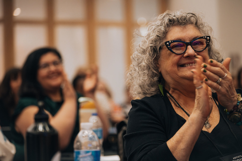 Artists Thrive Summit attendees clapping