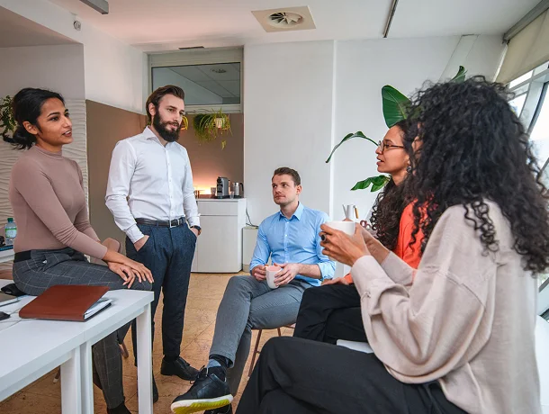 A research team briefing colleagues on findings from a group discussion